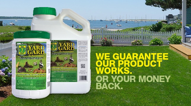 Yard Gard repellent bottles with satisfaction guarantee over lawn.